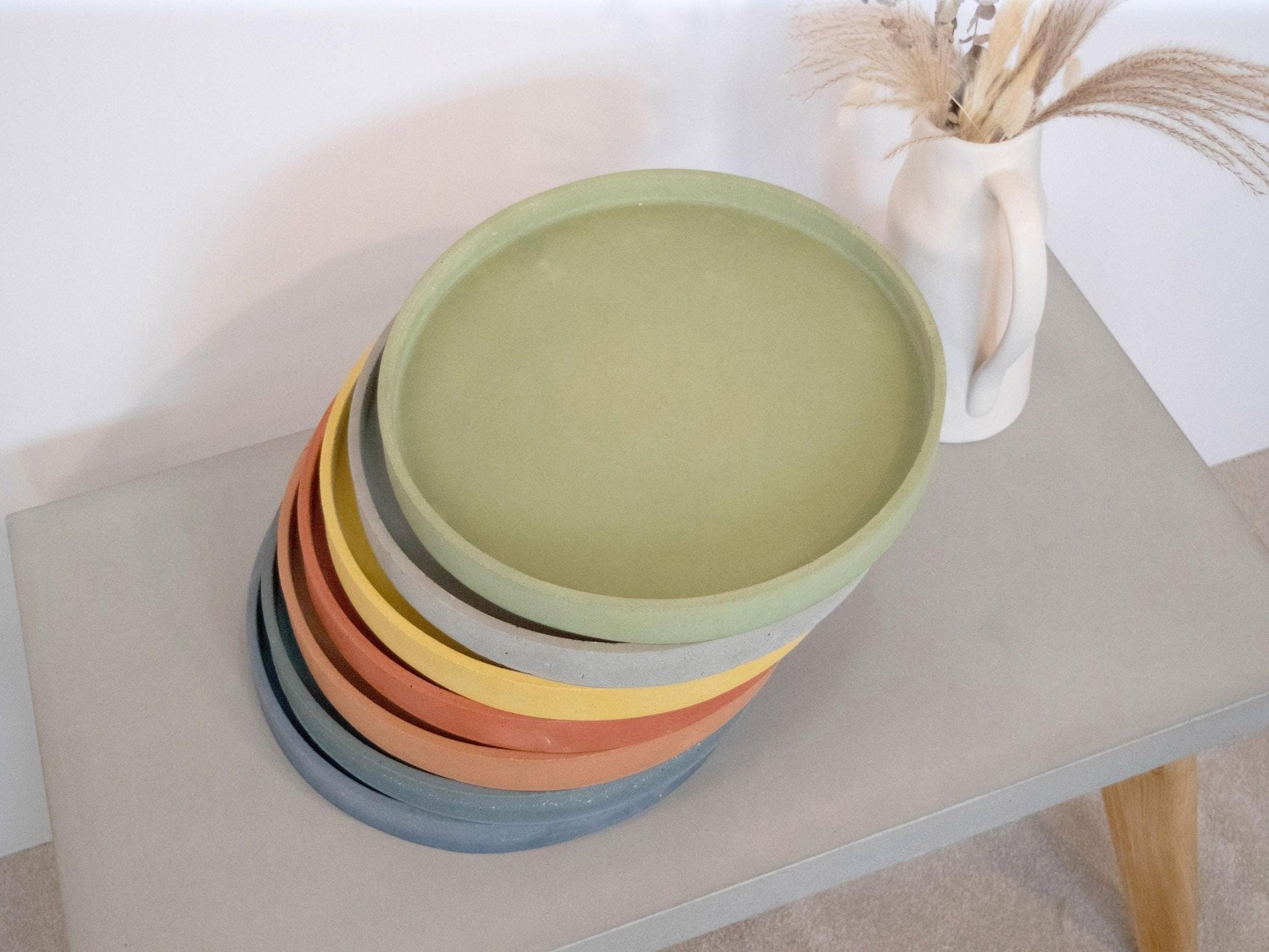 a stack of circular concrete trays