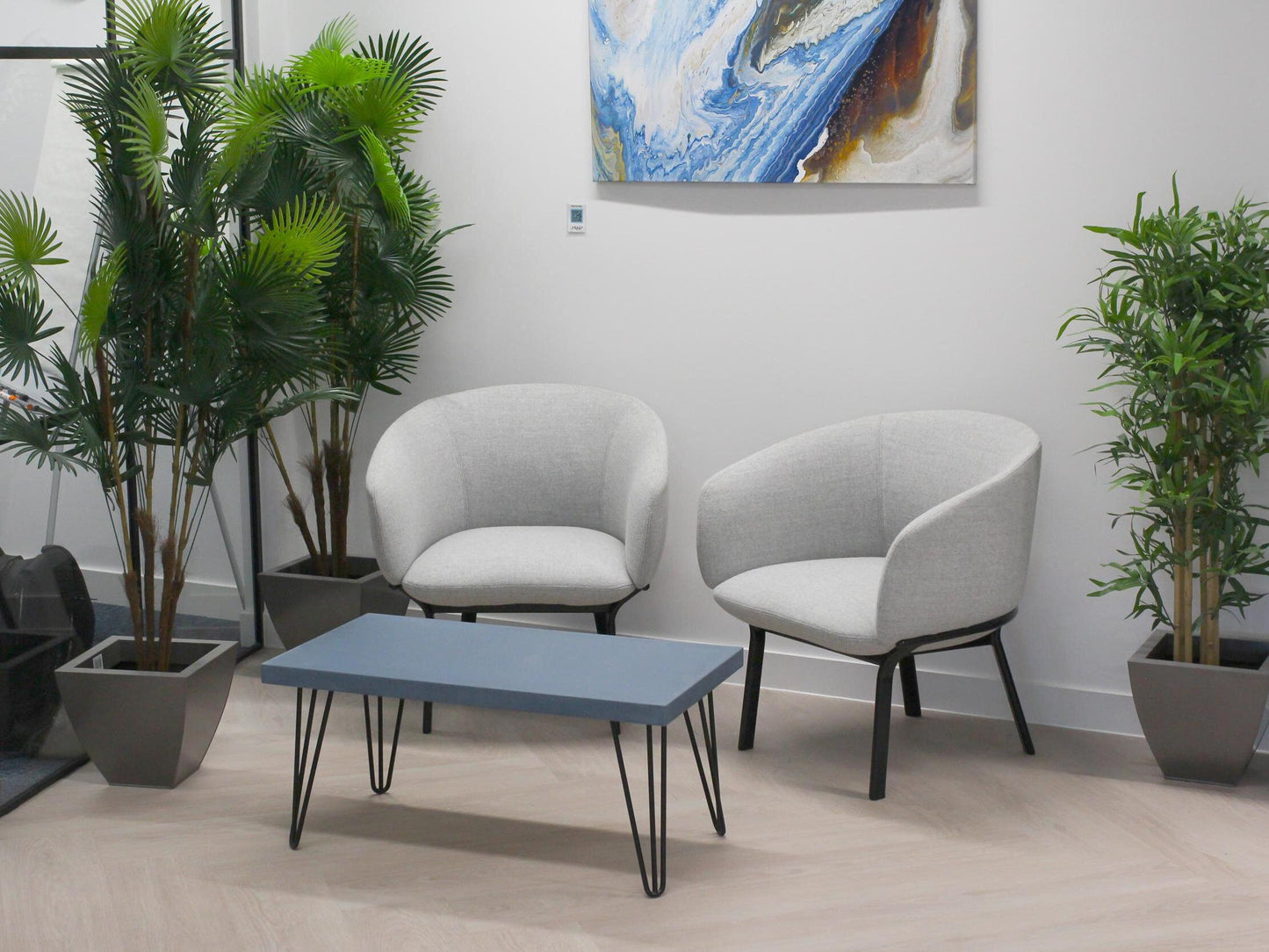 Large blue concrete coffee table with hairpin legs