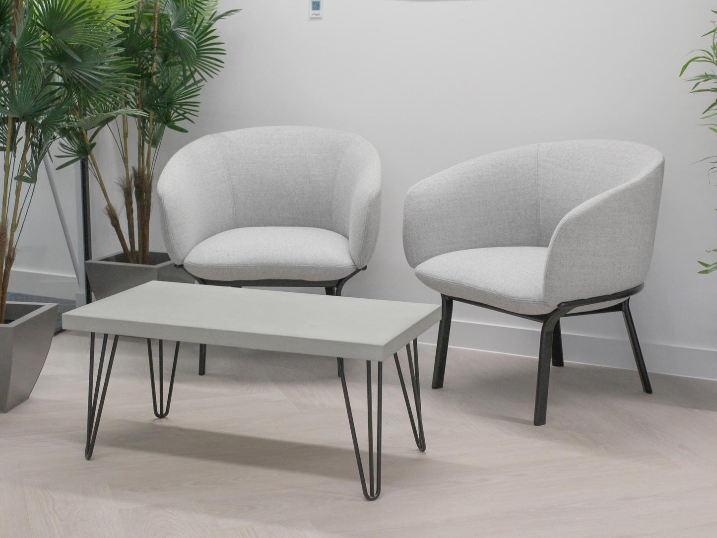 Large grey concrete coffee table with hairpin legs