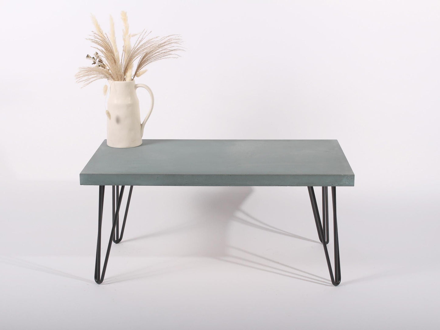 Large lagoon blue concrete coffee table with hairpin legs