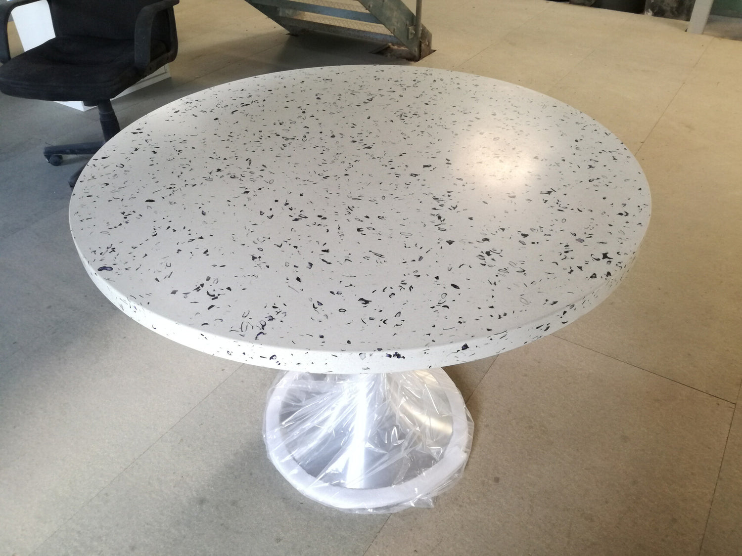 Round terrazzo dining table