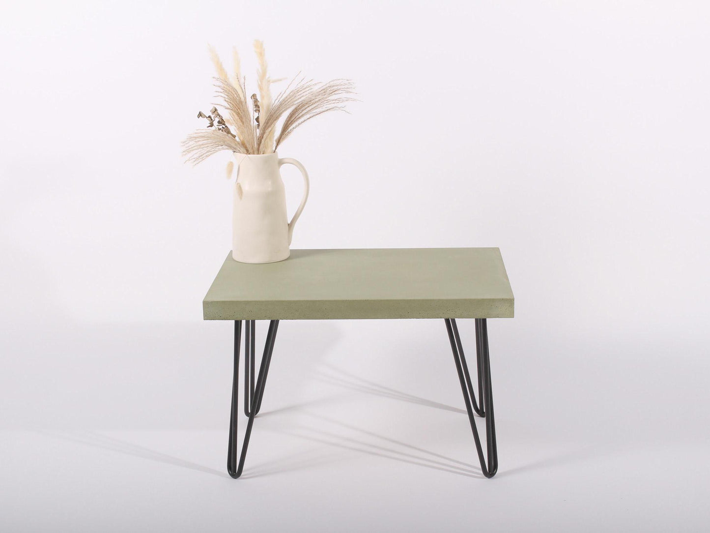 small green concrete table with hairpin legs
