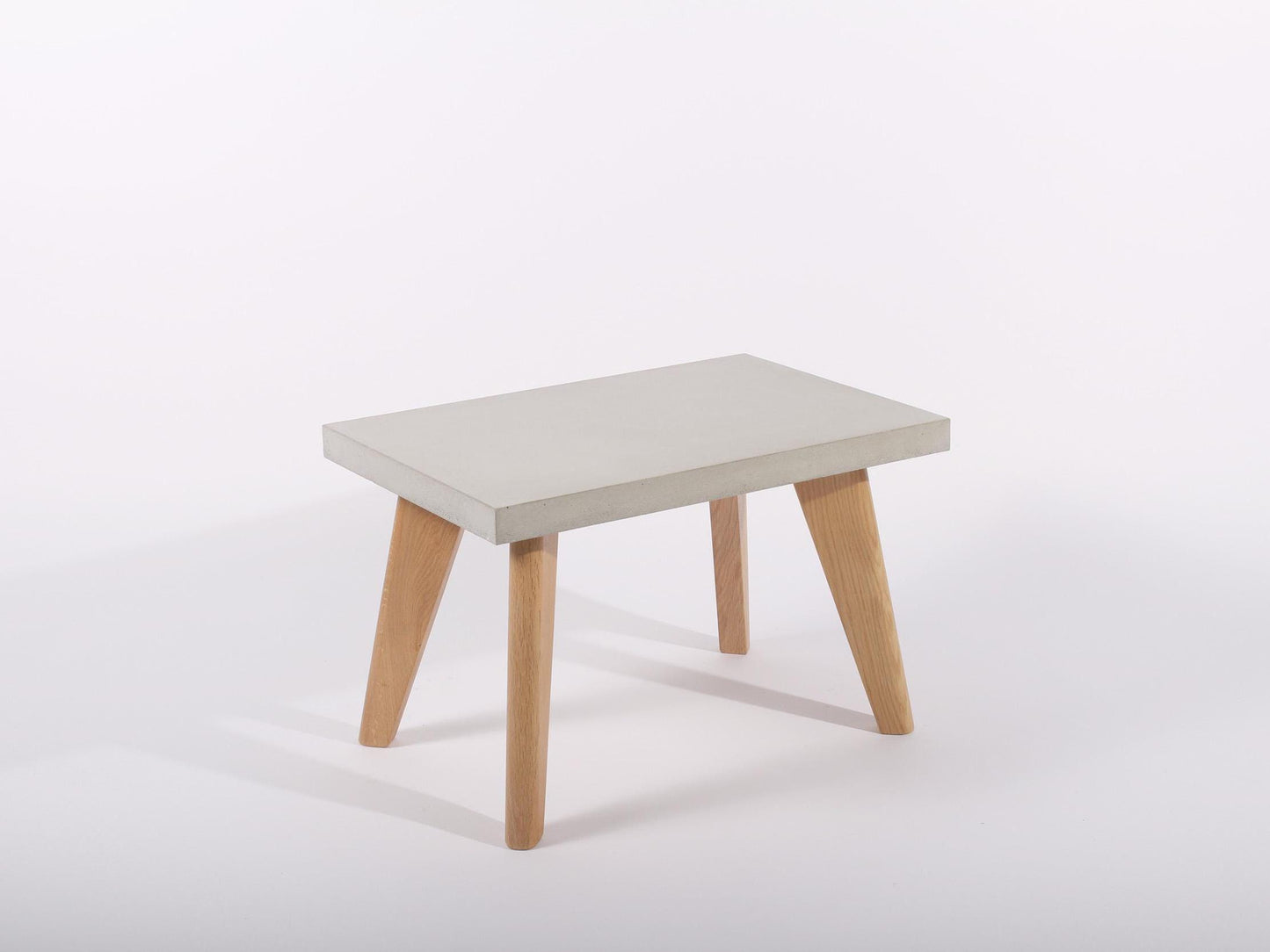 small grey concrete table with oak legs