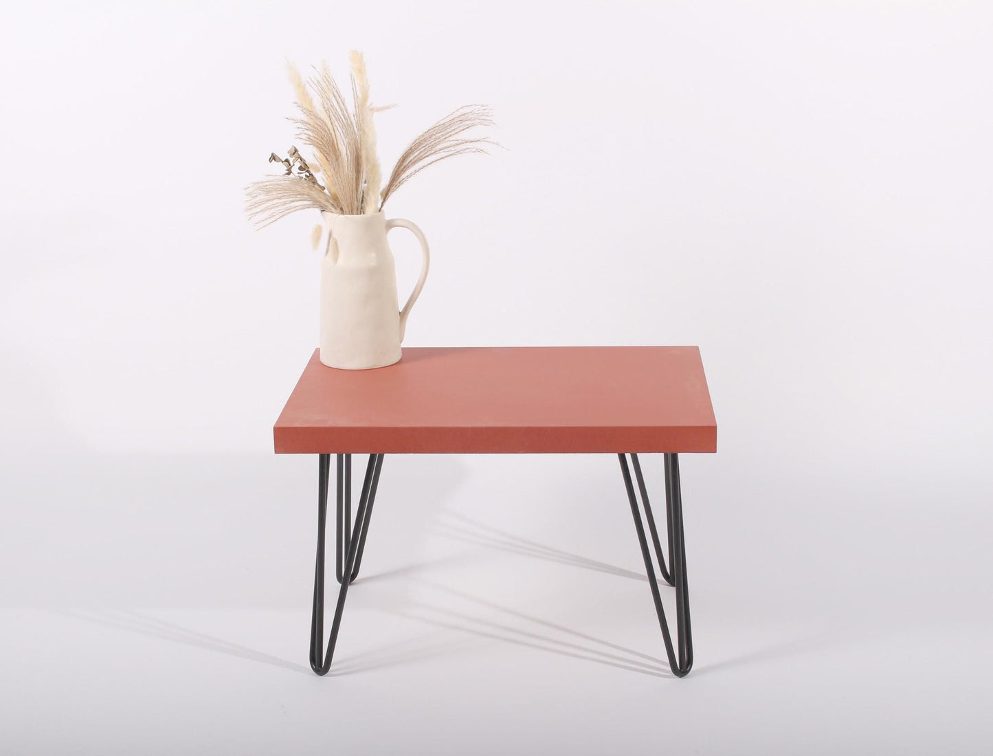 small red concrete table with hairpin legs