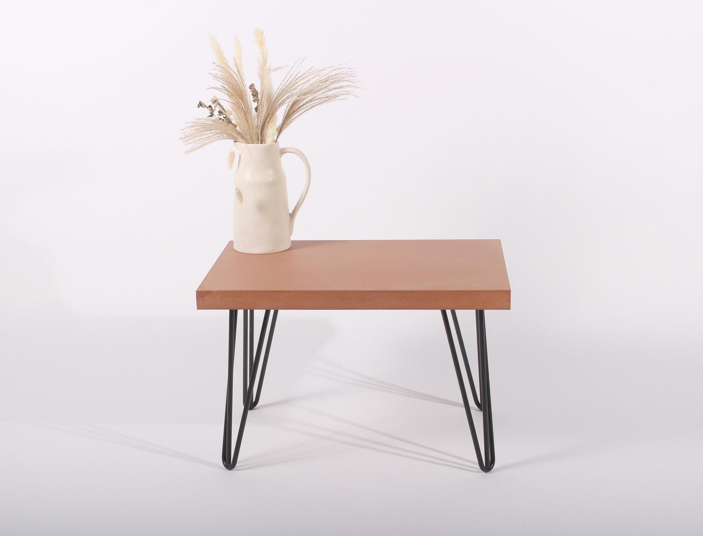 small terracotta concrete table with hairpin legs