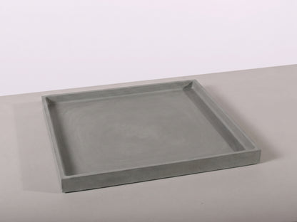 Gray rectangular tray on a light gray surface with a white background