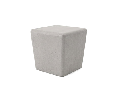 Gray concrete cube-shaped stool on a white background