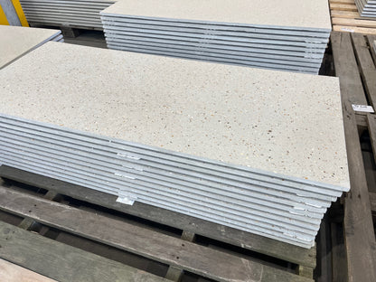 Stacks of concrete tiles on a wooden pallet