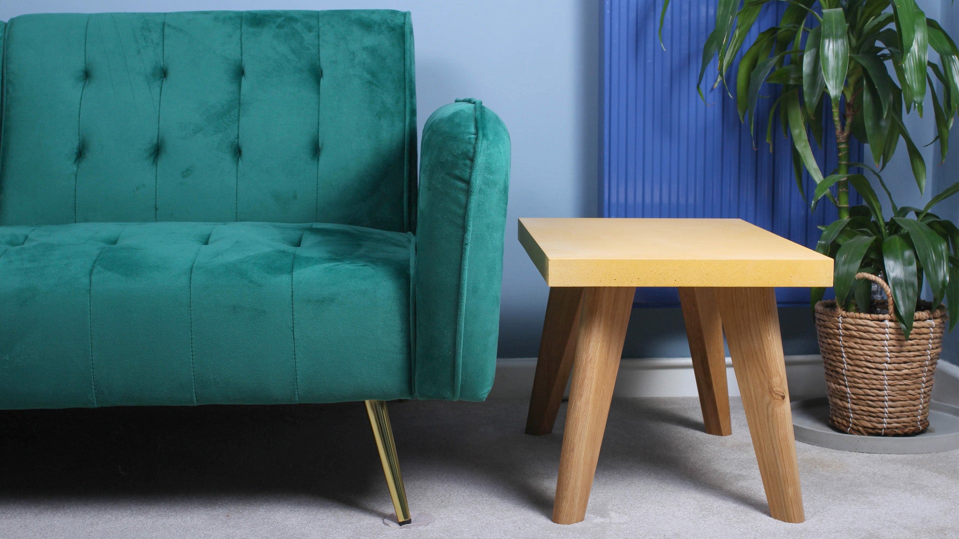 Yellow concrete table next to sofa