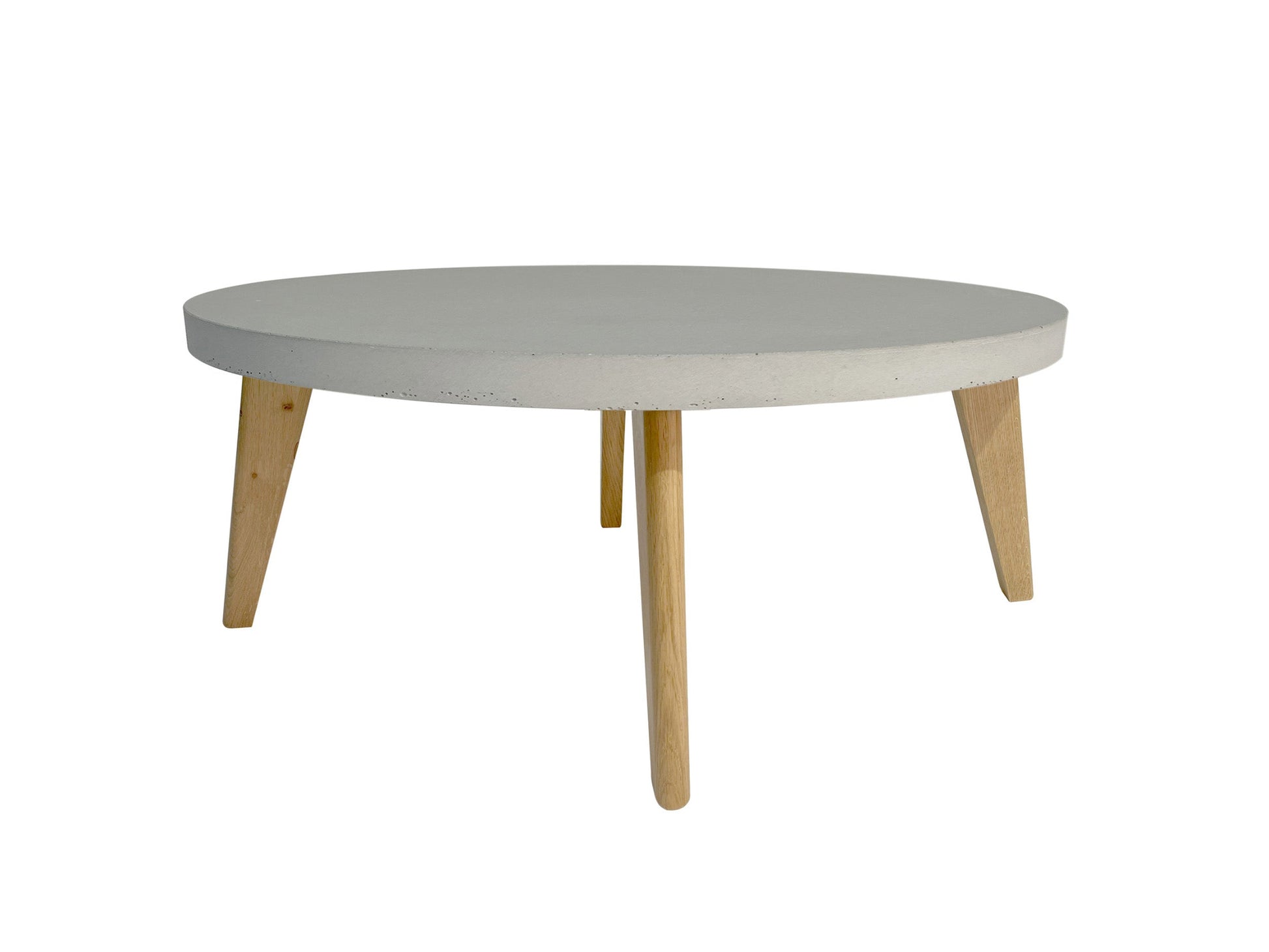 Round coffee table with concrete table top and wooden legs on a white background