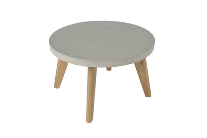 Round coffee table with light gray top and wooden legs on a white background