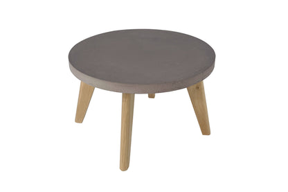Round coffee table with gray top and wooden legs on a white background