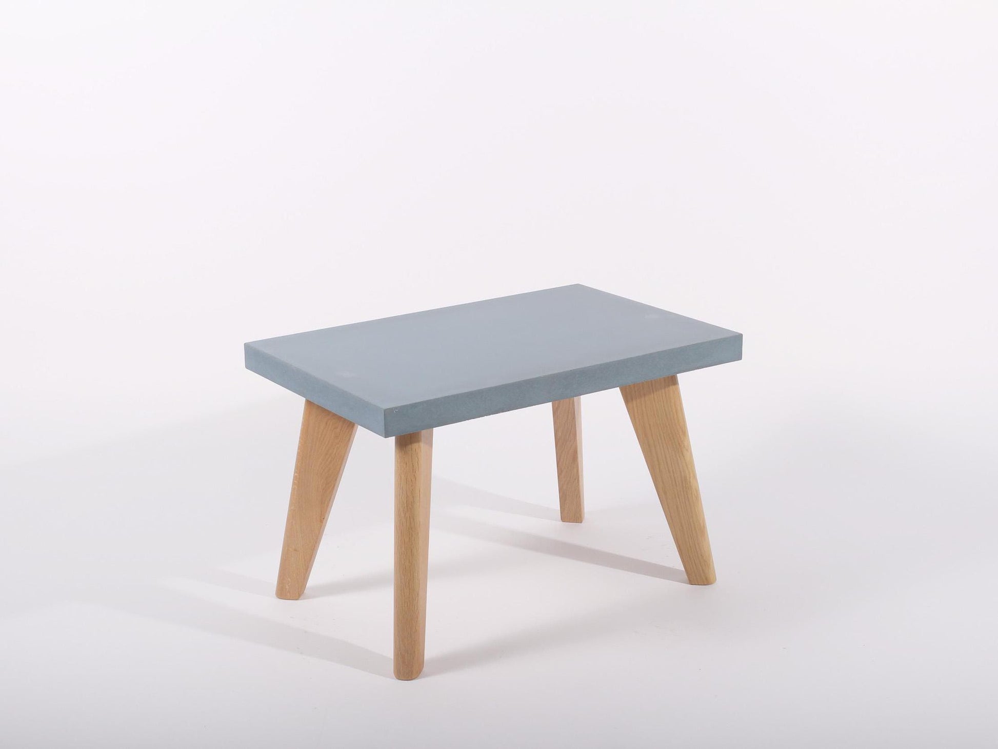 small blue concrete table with oak legs