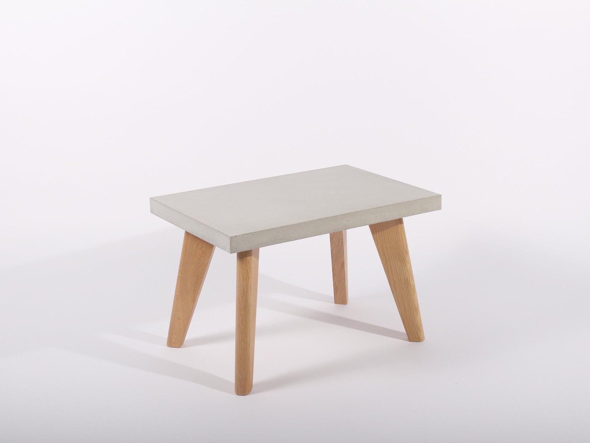 small grey concrete table with oak legs