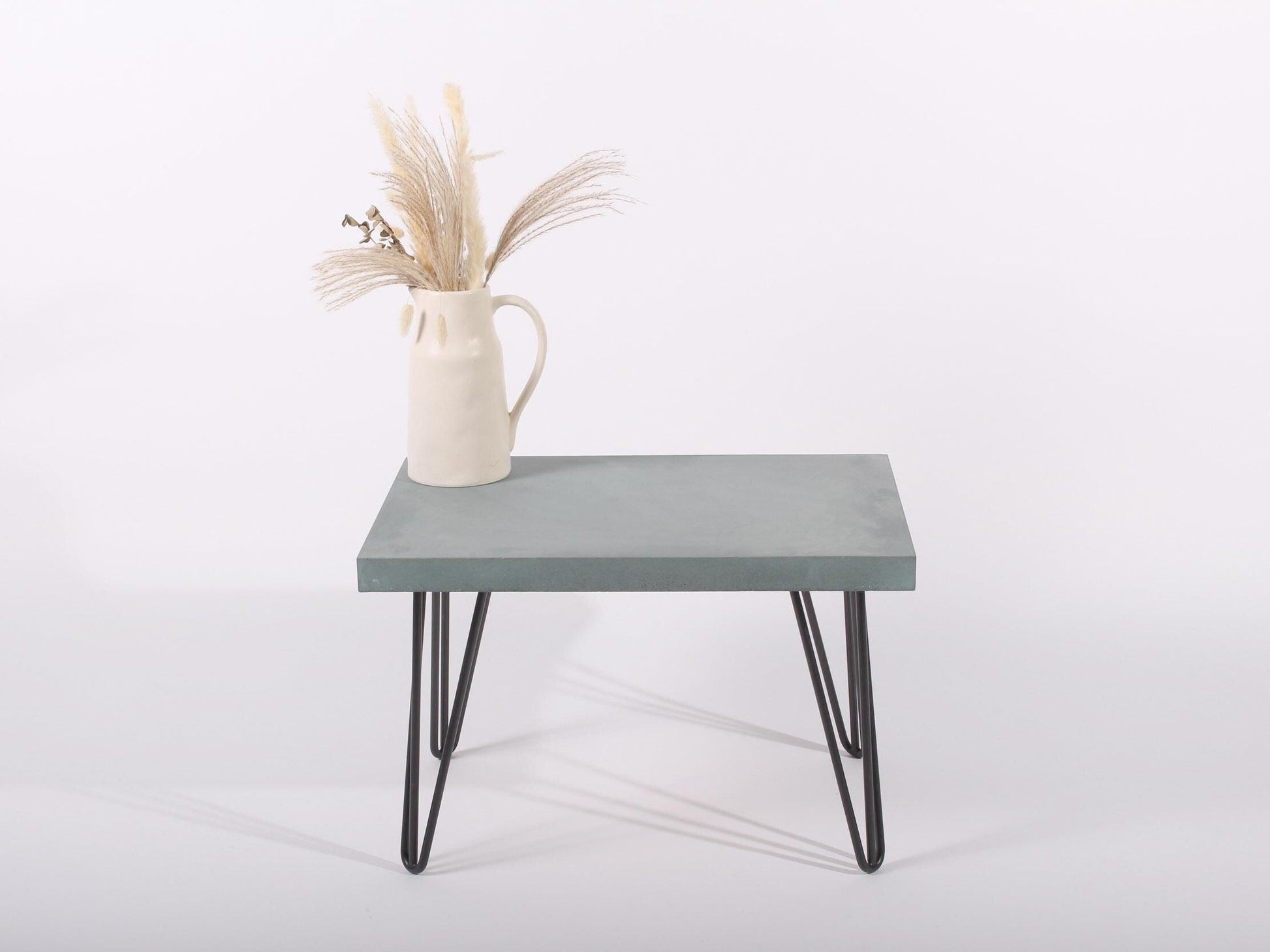 small lagoon blue concrete table with hairpin legs