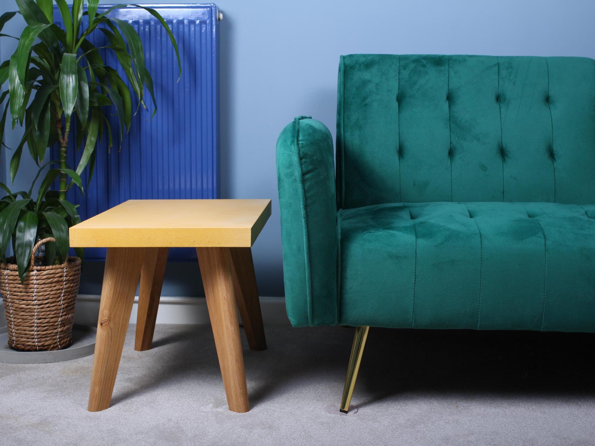 small yellow concrete table with oak leg